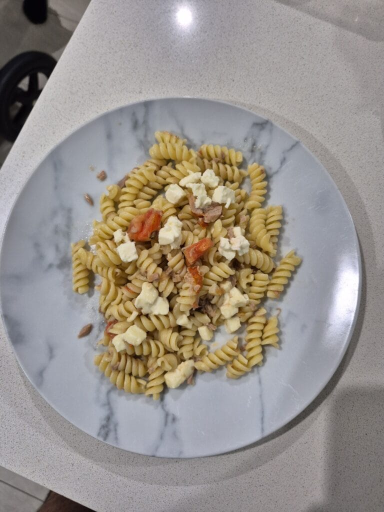 “Italian pasta with tuna, cherry tomatoes, fresh mozzarella, and basil”.