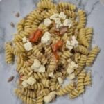 “Italian pasta with tuna, cherry tomatoes, fresh mozzarella, and basil”.